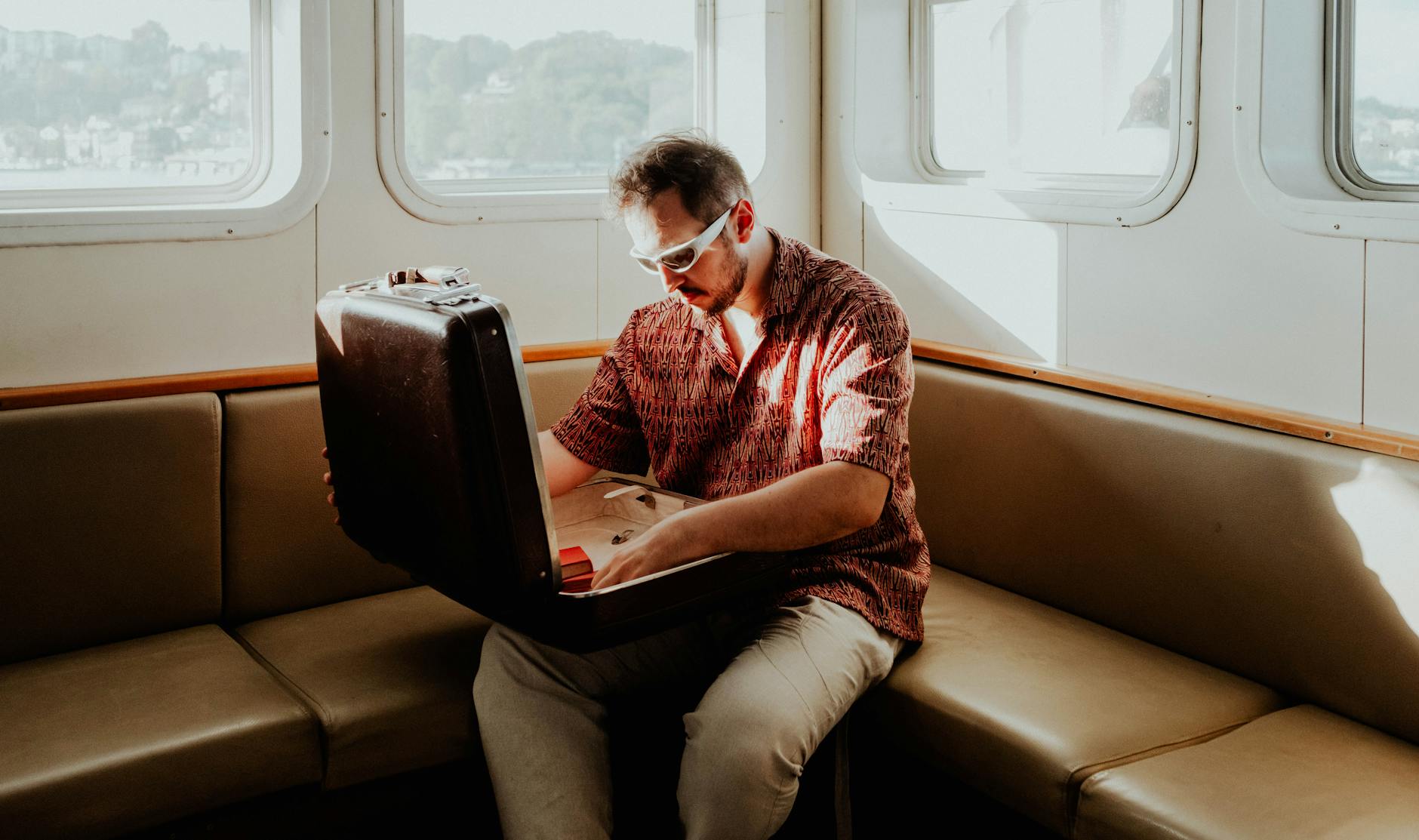 man packs a cabin suitcase  